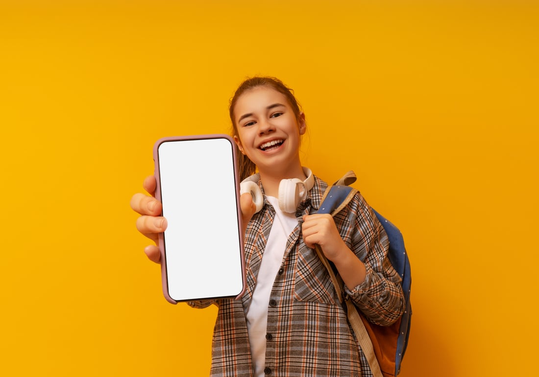 kid showing screen of mobile phone