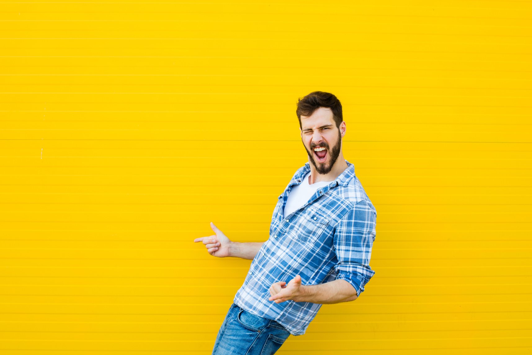 young happy man on yellow